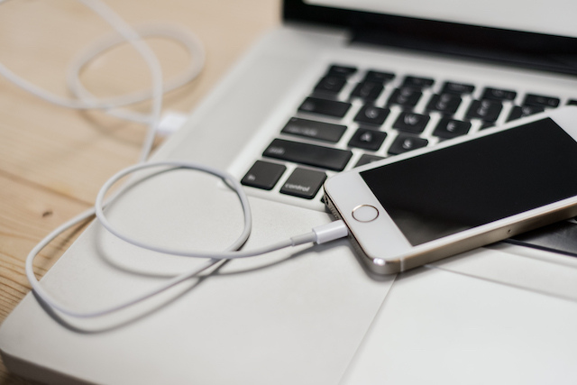 iPhone charging in Apple laptop