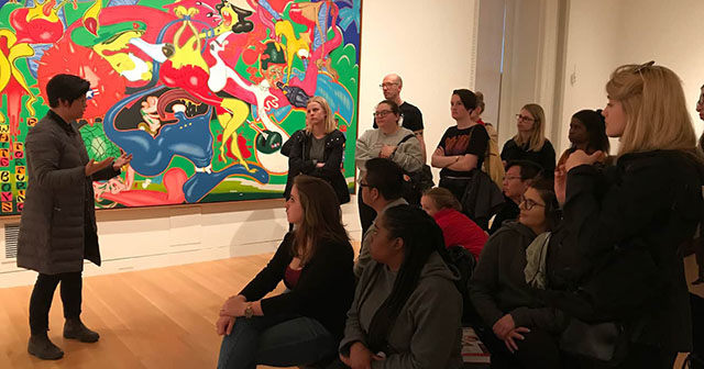 Photograph of students listening to a talk at the Smithsonian American Art Museum