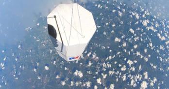 Photo taken from AU's high-altitude balloon shows payload with clouds and ground far below