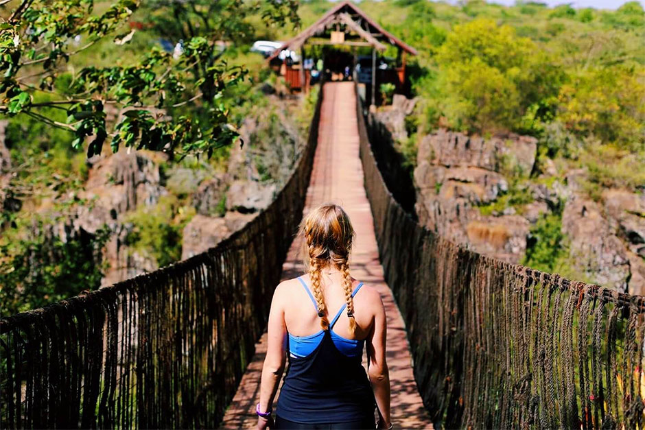 Study abroad student on bridge in Kenya.