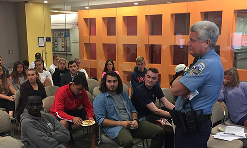 Students at meeting, listening to speaker
