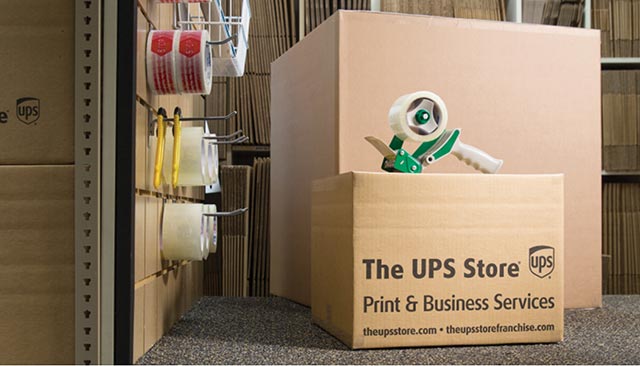 Boxes and packing materials, with the words "The UPS Store" on the side
