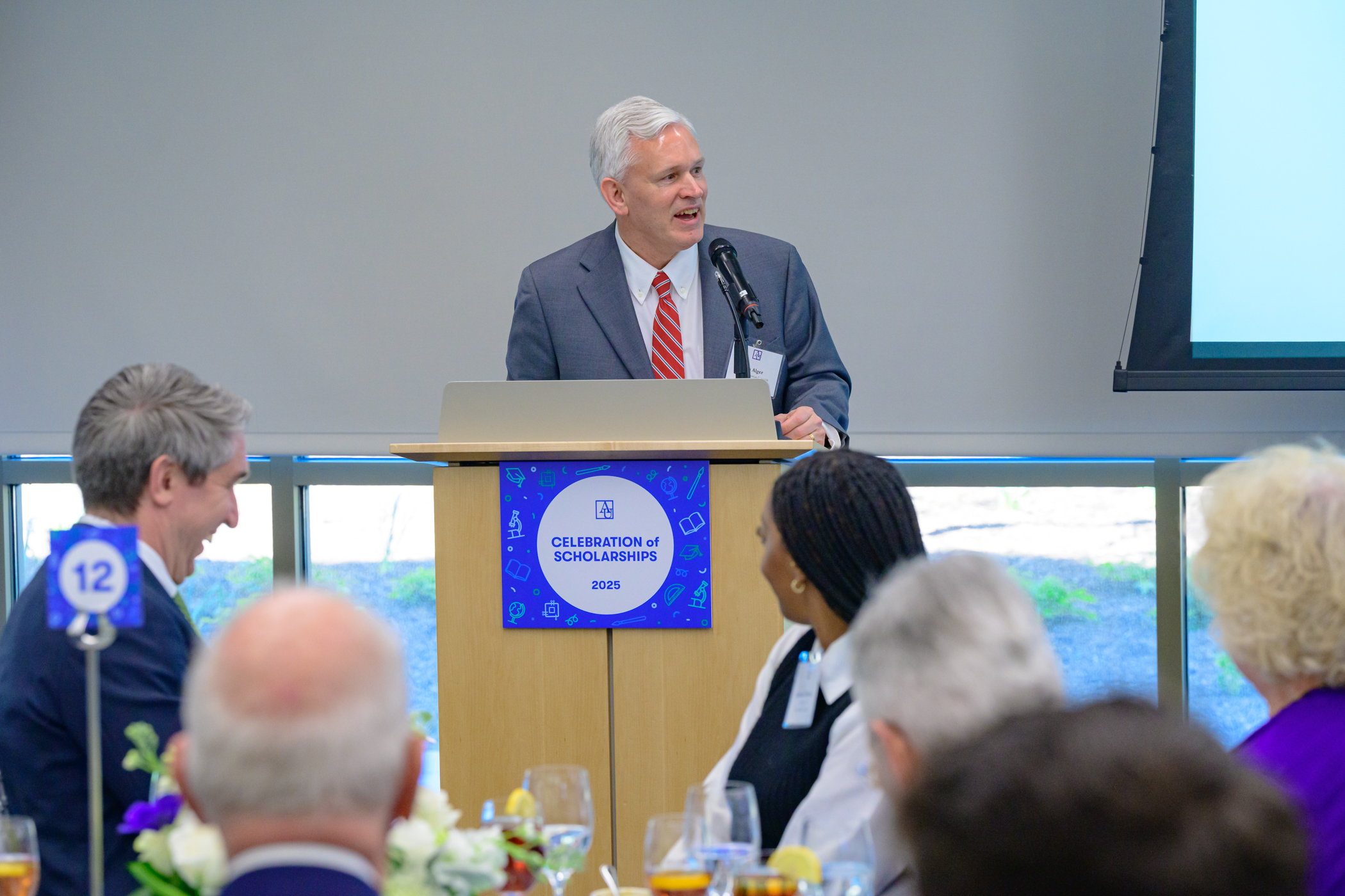 President Alger speaking at the podium at the 2025 Celebration of Scholarships