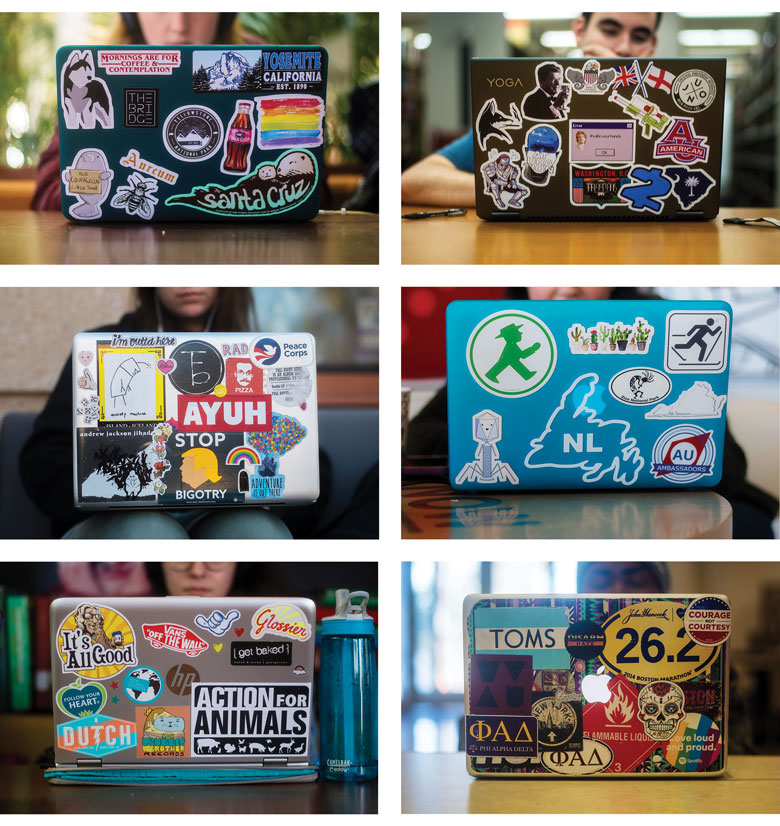 six laptops decorated with an array of colorful stickers