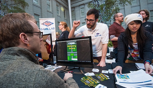 Faculty and students from American University's Game Lab at the Smithsonian's Indie-Arcade.