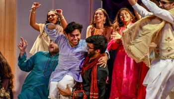 Indian and Pakistani student organization participants dancing on stage