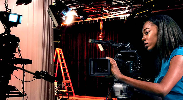 Film student Shayla Racquel behind a camera