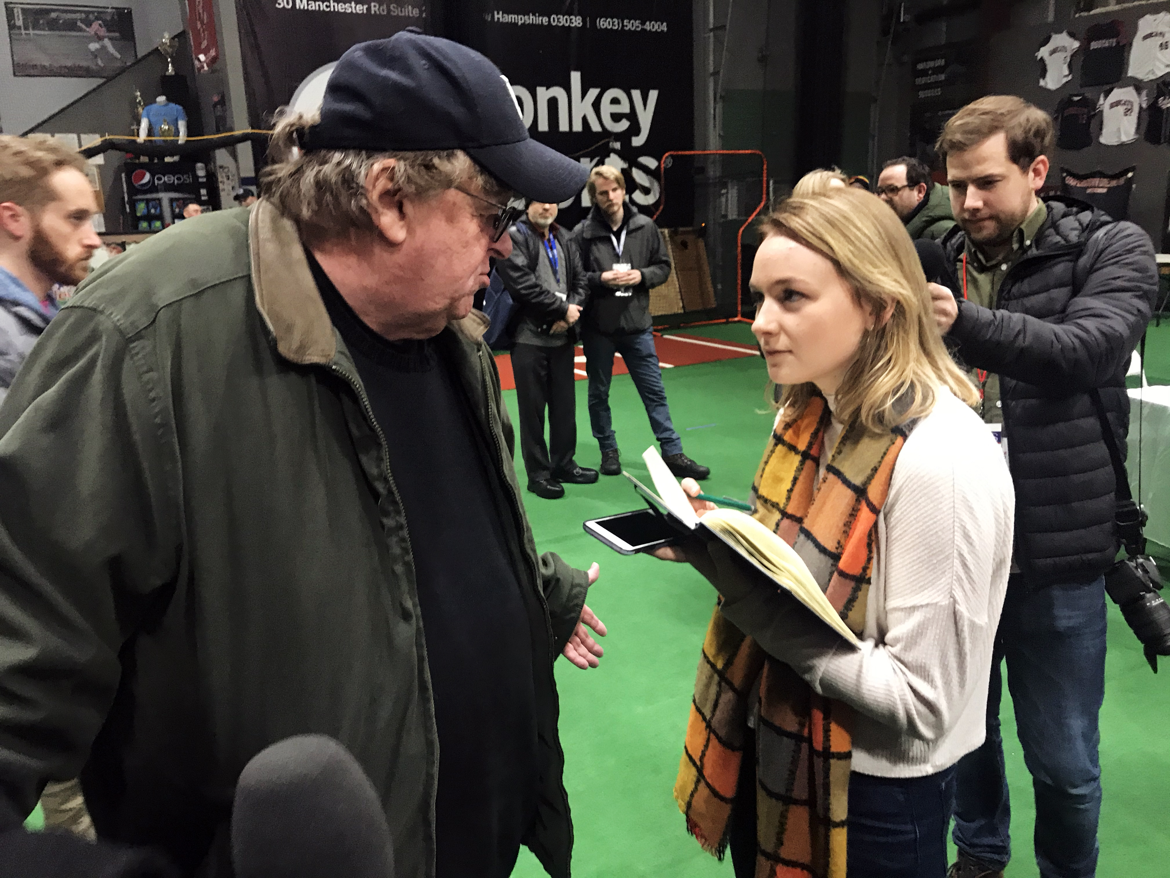 nhprimaries_karissa waddick SOC student Karissa Waddick corners filmmaker Michael Moore to ask questions following a Sanders watch party in New Hampshire on Friday.