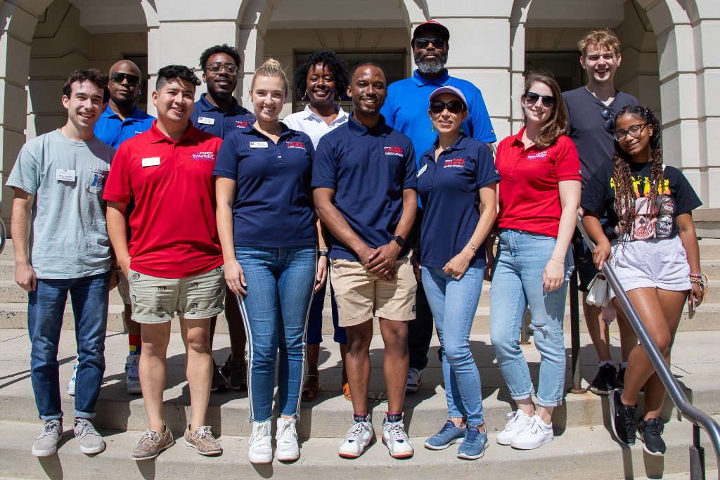 Staff members at the Center for Student Involvement gathered on the stairs of Mary Graydon Center.