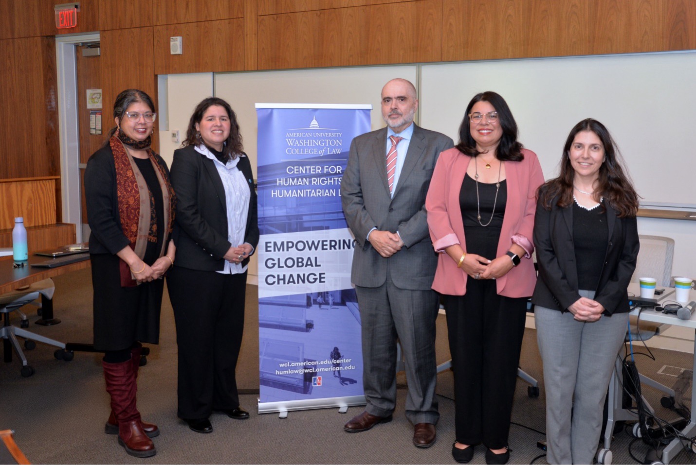 Professor Bertoni posing with panelists at the Empowering Global Change event