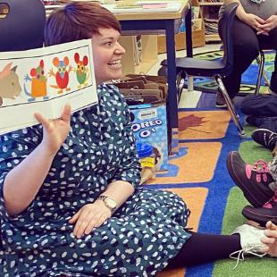 Photo of teacher reading aloud Photo of teacher reading aloud