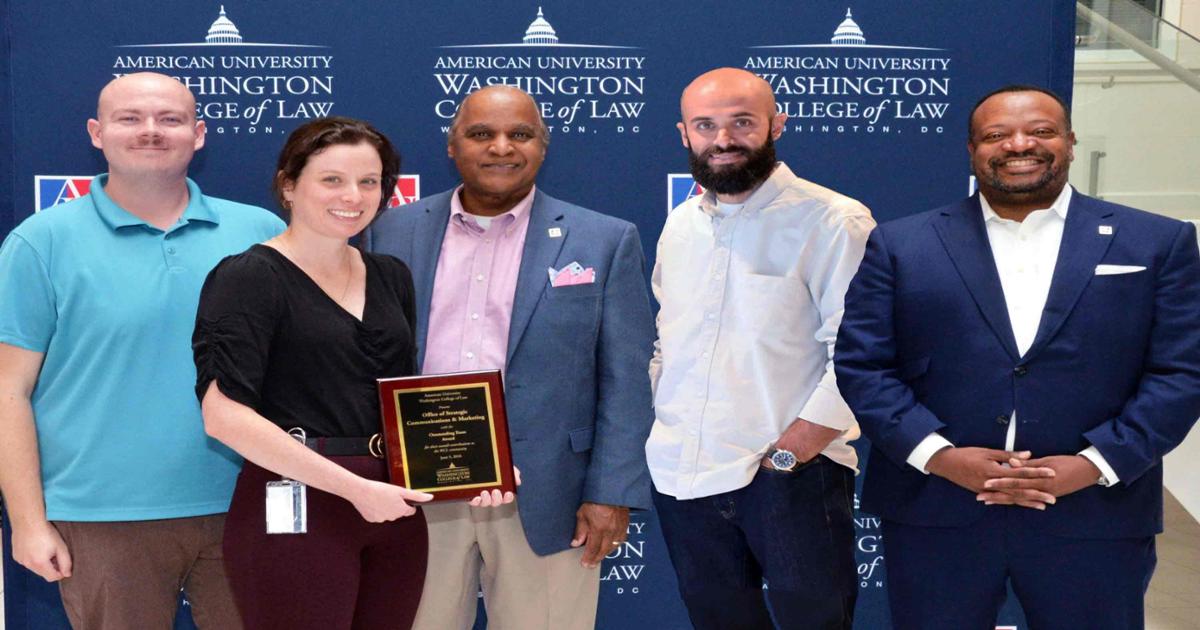 The Office of Strategic Communications and Marketing, (from left to right, Brice Helms, Liz Newton, Keith Pierce, and Erik Garcia) received the Outstanding Team Award from Dean Fairfax (right). The Office of Strategic Communications and Marketing, (from left to right, Brice Helms, Liz Newton, Keith Pierce, and Erik Garcia) received the Outstanding Team Award from Dean Fairfax (right).